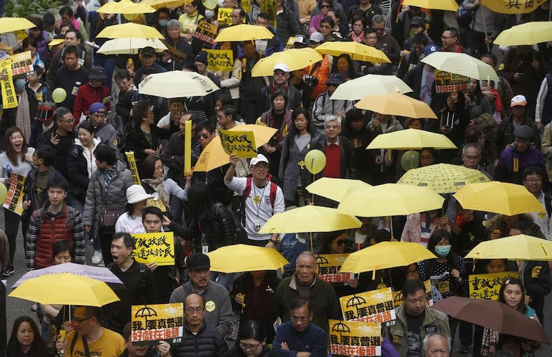 Pro-democracy activists take part in a march to Central, demanding for universal suffrage in Hong Kong. Kin Cheung / AP Photo