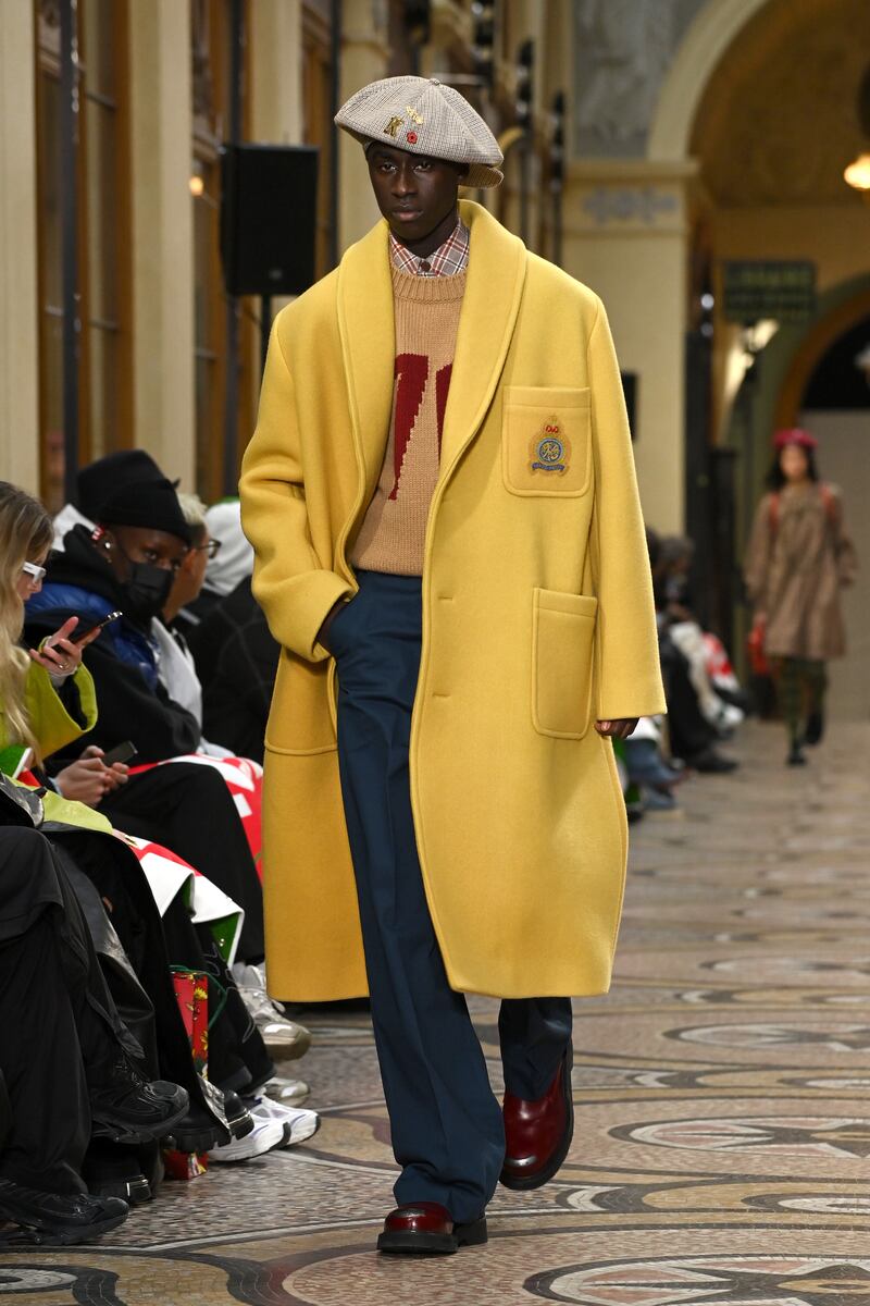 A relaxed silhouette at Kenzo, with a drop shouldered coat in yellow, with large patch pockets.