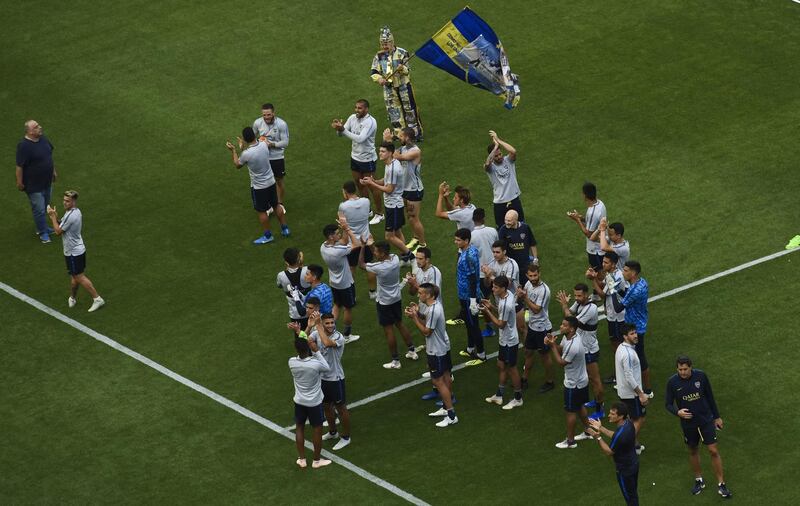 Boca Juniors players salute the crowd inside La Bombonera at the end of the training session. Getty Images