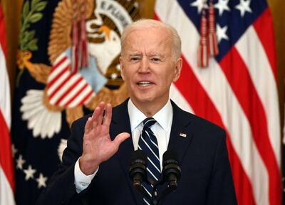 (FILES) In this file photo taken on March 25, 2021, US President Joe Biden answers a question during his first press briefing in the East Room of the White House in Washington, DC. Biden has suggested founding an initiative from "democratic" countries to rival China's trillion-dollar Belt and Road infrastructure initiative as tensions spike between the Asian power and Western nations. Biden said late On March 26, 2021, that he floated the proposal in a call with British Prime Minister Boris Johnson amid a row over sanctions against abuses targeting the Uyghur minority in China's northwestern Xinjiang region. / AFP / Jim WATSON
