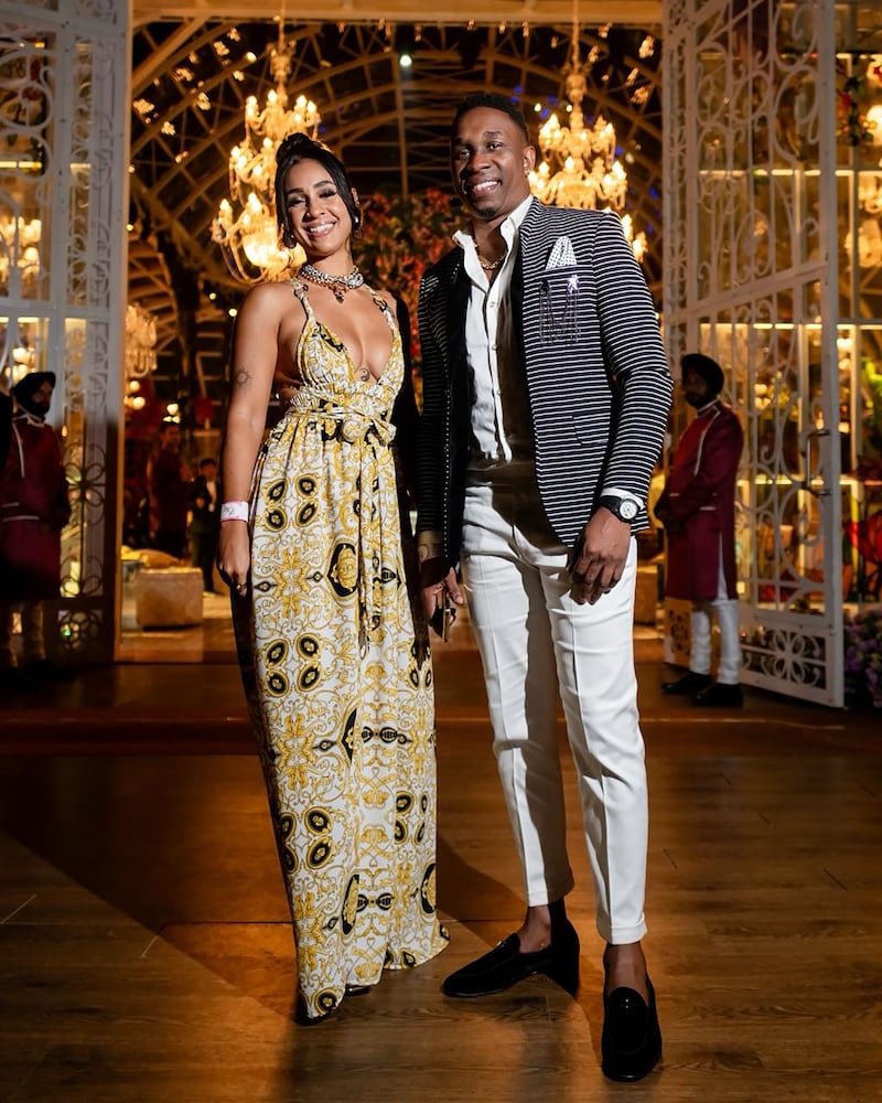 West Indies's former cricket captain Dwayne Bravo, right, and wife Regina Ramjit