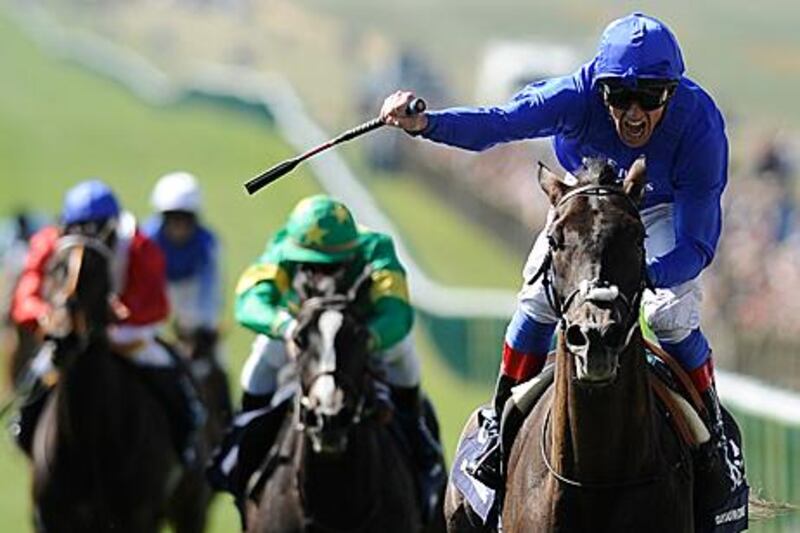 Frankie Dettori celebrates as Blue Bunting passes the winning post to win the 1000 Guineas at Newmarket yesterday.