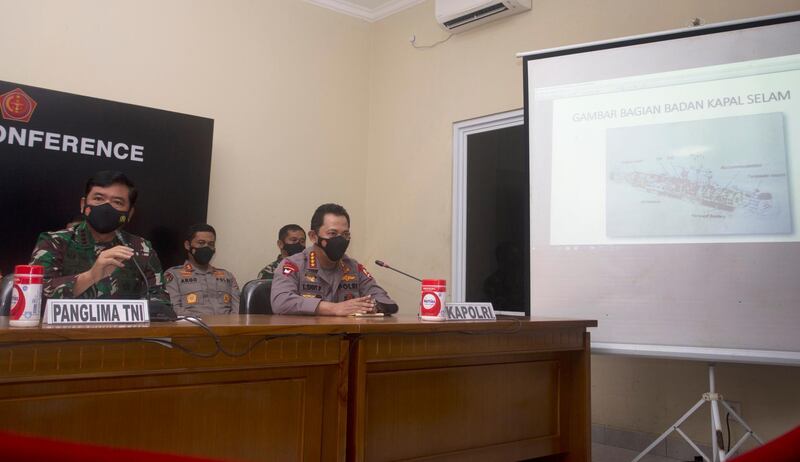 Indonesian Military chief Hadi Tjahjanto, left, shows an image of the Indonesian Navy submarine KRI Nanggala on a screen during a news conference at Ngurah Rai Military Air Base in Bali, Indonesia. AP Photo