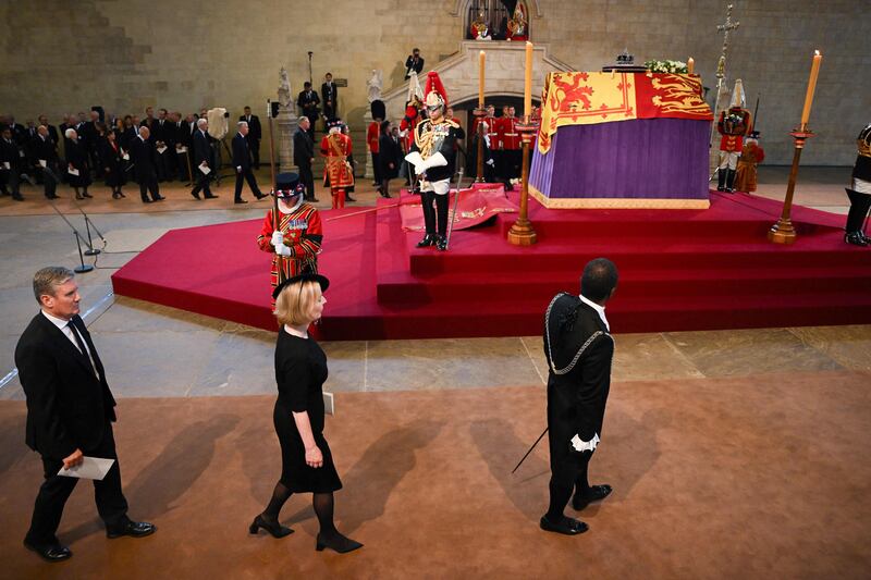 Britain's Labour Party leader Sir Keir Starmer and Ms Truss leave after a service for the reception of Queen Elizabeth's coffin at Westminster Hall in the Palace of Westminster. AFP