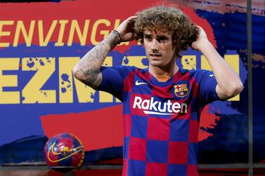 epa07717236 French striker Antoine Griezmann poses for the media during his presentation as a FC Barcelona's new player held at Camp Nou Stadium in Barcelona, Spain, 14 July 2019. EPA/QUIQUE GARCIA