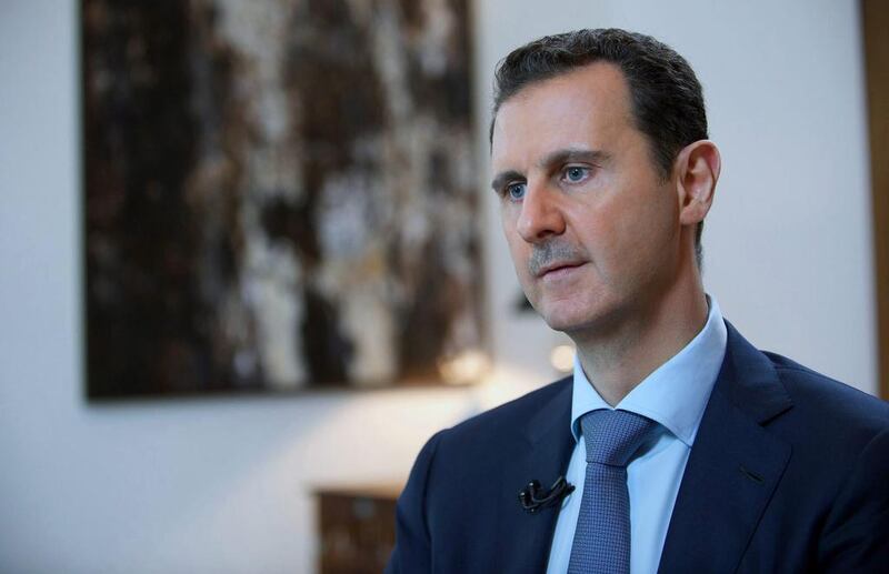 FILE - In this Sunday, Oct. 4, 2015 file photo released by the Syrian official news agency SANA, shows Syrian President Bashar Assad, speaking during an interview with the Iran's Khabar TV, in Damascus, Syria. (SANA via AP, File)