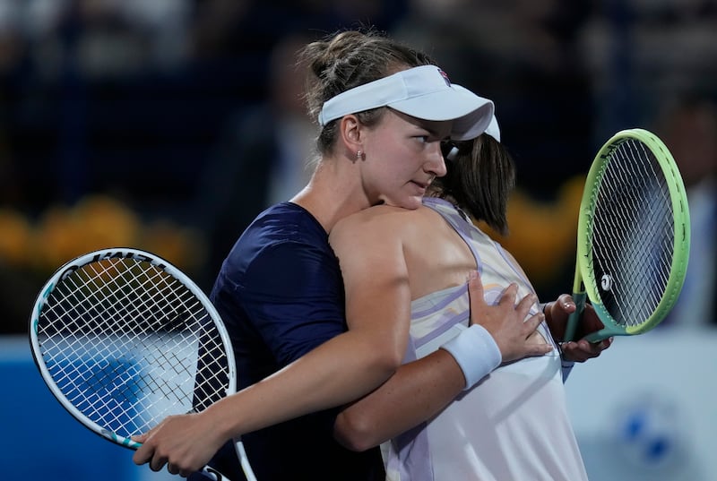 Czech Republic's Barbora Krejcikova, left, greets Poland's Iga Swiatek after her win in the Dubai Duty Free Tennis Championships final. AP