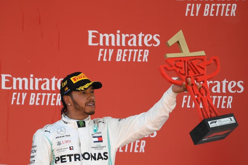 Mercedes' British driver Lewis Hamilton celebrates on the podium after winning the Spanish Formula One Grand Prix at the Circuit de Catalunya in Montmelo in the outskirts of Barcelona on May 12, 2019. (Photo by LLUIS GENE / AFP)