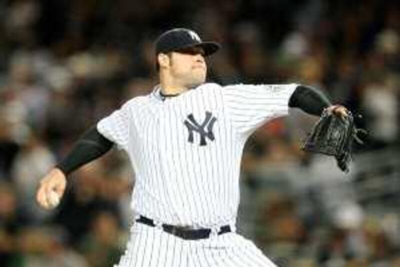 NEW YORK - SEPTEMBER 25: Starting pitcher Joba Chamberlain #62 of the New York Yankees delivers a pitch in the first inning against the Boston Red Sox at Yankee Stadium on September 25, 2009 in New York, New York.   Al Bello/Getty Images/AFP *** Local Caption ***  890463-01-10.jpg