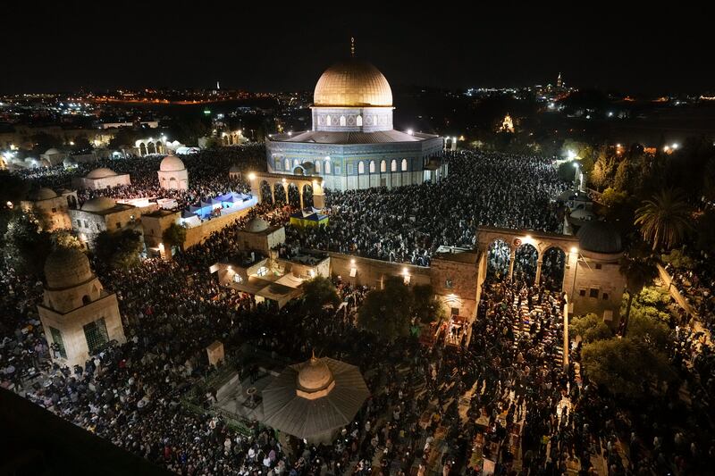 Palestinians pray during Laylat Al Qadr, or the Night of Power, in Al Aqsa Mosque compound, Jerusalem. AP