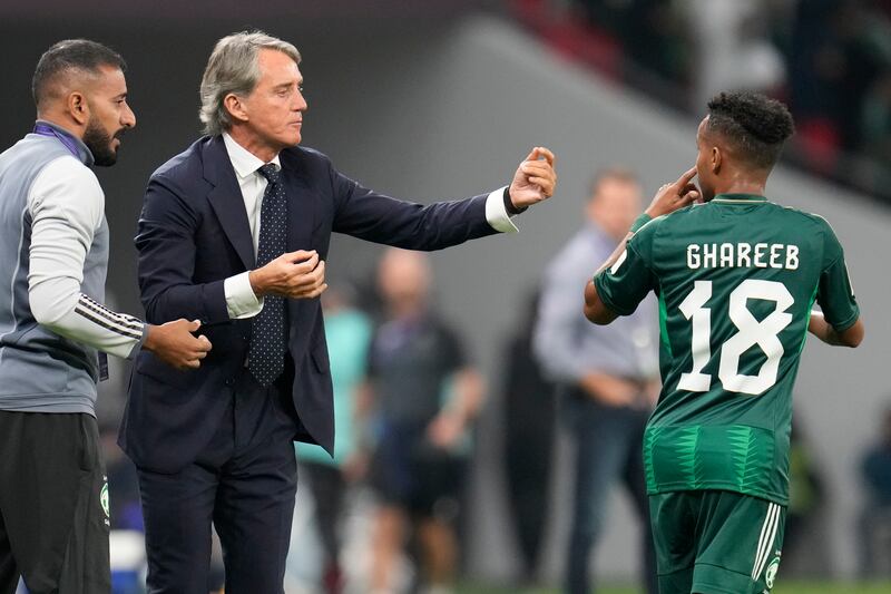 Saudi Arabia manager Roberto Mancini instructs Abdulrahman Ghareeb during the Asian Cup match against Kyrgyzstan. AP