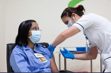 Asha Susan Philip, a nurse with Dubai Health Authority, receives the Pfizer vaccine. Dubai Media Office
