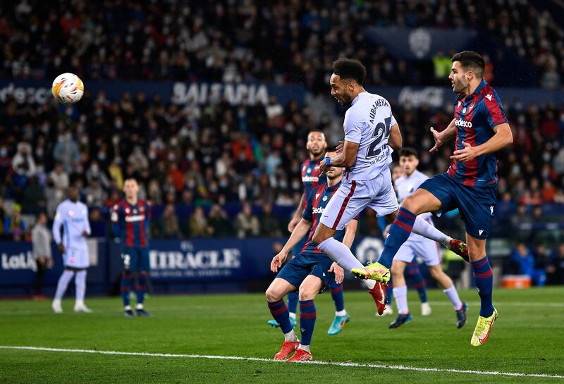 Barcelona's Pierre-Emerick Aubameyang heads home in the La Liga match against Levante at Estadio Ciudad de Valencia in April, 2022. Reuters