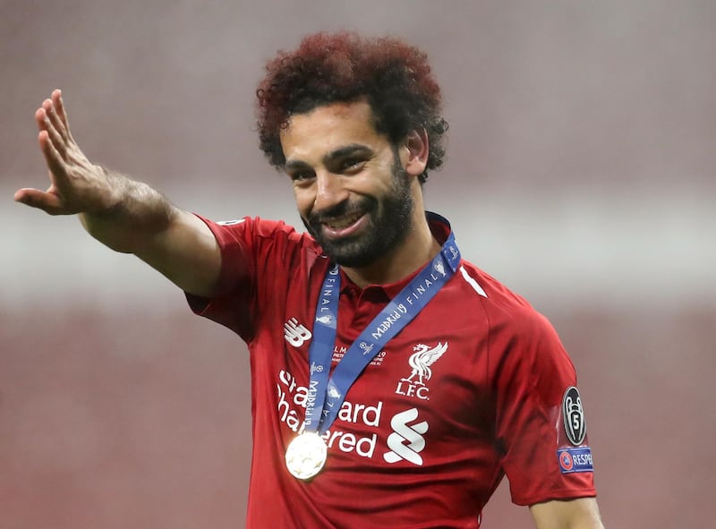 Salah acknowledges Liverpool's travelling fans post match. Reuters