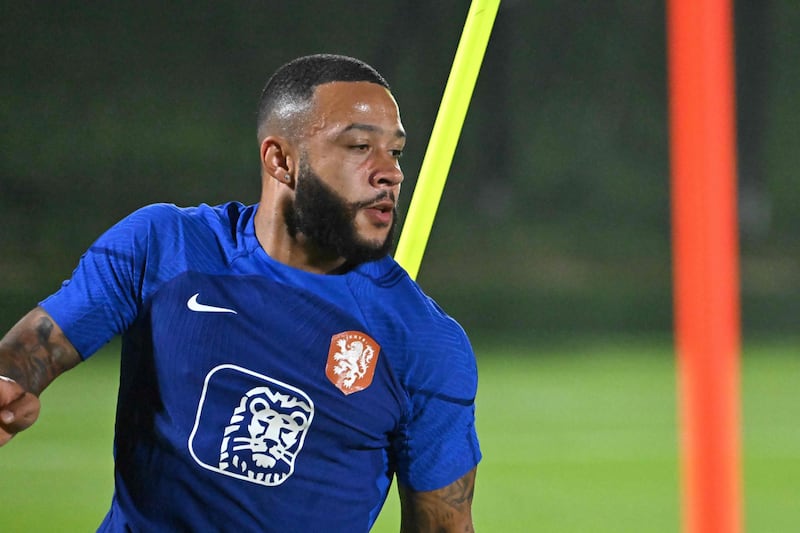 Memphis Depay trained with the Netherlands squad in Qatar this week but will miss the opening game. AFP