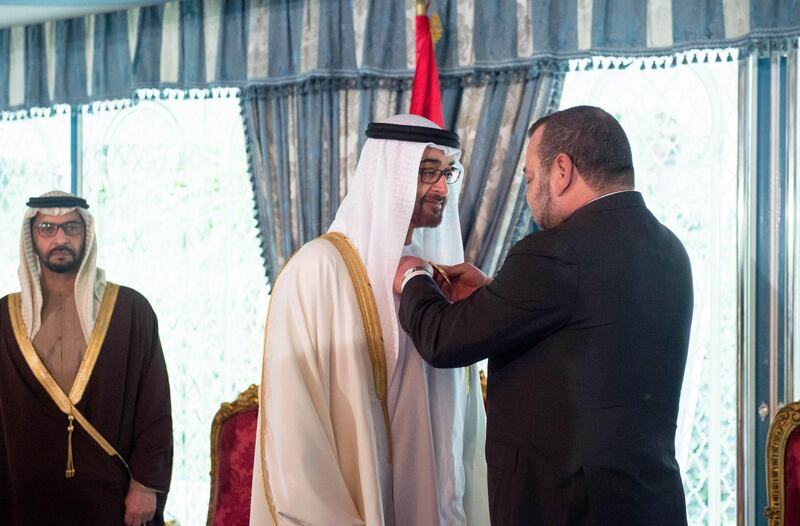 CASABLANCA, MOROCCO - March 17, 2015: HM King Mohammed VI of Morocco (R), presents HH Sheikh Mohamed bin Zayed Al Nahyan Crown Prince of Abu Dhabi and Deputy Supreme Commander of the UAE Armed Forces (C), with The Order of Muhammadi Medal of the First Degree ( Wissam Al Muhammadi ), at the Royal Palace of Casablanca. Witnessing the honor is HH Sheikh Hamdan bin Zayed Al Nahyan UAE Deputy Prime Minister and Ruler of the Western Region (L).

( Rashed Al Mansoori / Crown Prince Court - Abu Dhabi )