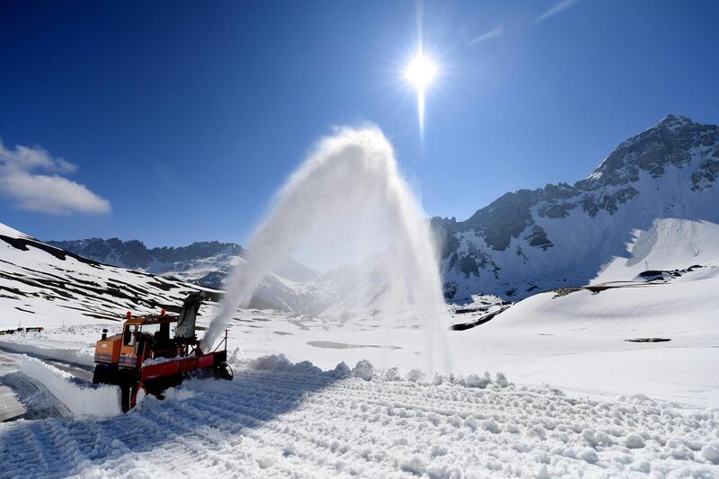 A snow thrower clears snow from the Galibier pass to open the road linking the department of Savoie to the Hautes-Alpes, in Valloire, France. Jean-Pierre Clatot / AFP Photo