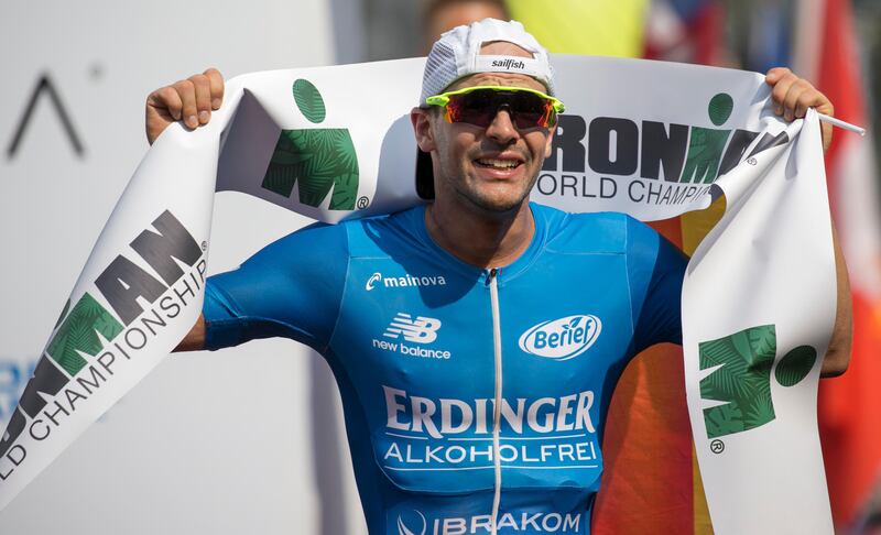 Patrick Lange, of Germany, reacts after winning the Ironman World Championship Triathlon in Kailua-Kona, Hawaii. Marco Garcia / AP Photo