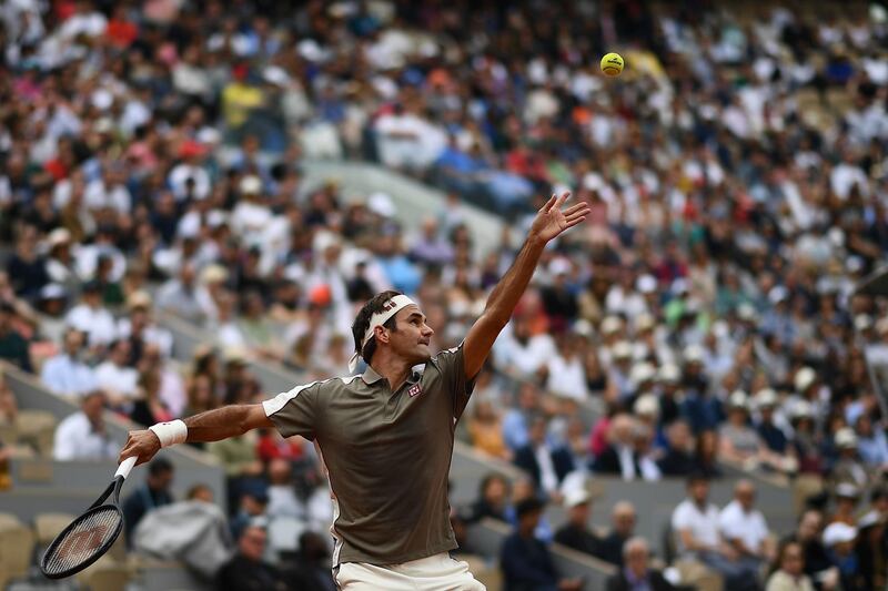 Switzerland's Roger Federer returns the ball to Italy's Lorenzo Sonego during their men's singles first round match on day 1 of The Roland Garros 2019 French Open tennis tournament in Paris on May 26, 2019. / AFP / Anne-Christine POUJOULAT
