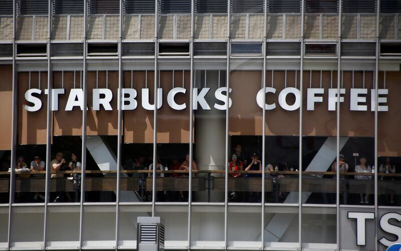 The signboard of Starbucks coffee is pictured at its branch in Tokyo, Japan August 13, 2018. REUTERS/Kim Kyung-Hoon