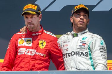 Sebastian Vettel, left, is out of contract with Ferrari at the end of the season and Lewis Hamilton's Mercedes team could make an approach. AP