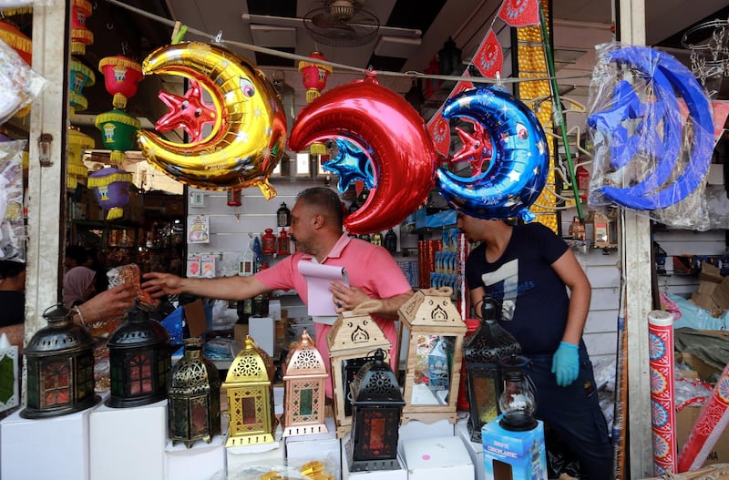 Iraqis shop for food ahead of the first day of Ramadan at the Shorjah market in central Baghdad, Iraq.  EPA