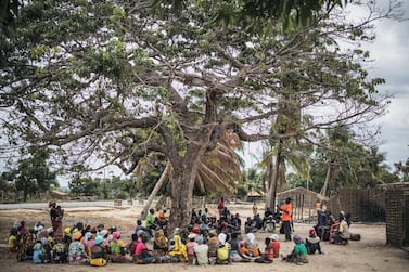 Residents gather for a meeting in the recently attacked village of Aldeia da Paz outside Macomia, on August 24, 2019. ISIS-linked fighters have attacked the region again in recent days. AFP
