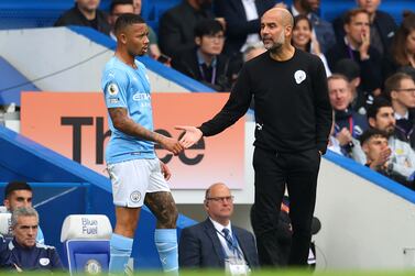 LONDON, ENGLAND - SEPTEMBER 25: Pep Guardiola, Manager of Manchester City interacts with Gabriel Jesus of Manchester City  during the Premier League match between Chelsea and Manchester City at Stamford Bridge on September 25, 2021 in London, England. (Photo by Catherine Ivill / Getty Images)