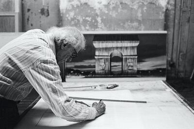 Christo in his studio working on a preparatory drawing for L'Arc de Triomphe, Wrapped. New York City, 2020. Estate of Christo V. Javacheff