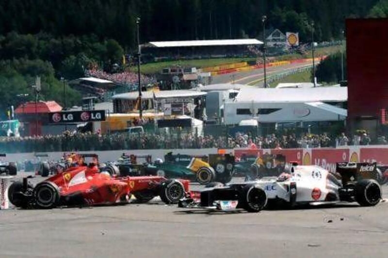 Kamui Kobayashi, right, saw his chances wrecked by the first-lap crash at the Belgian Grand Prix.