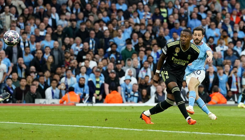 Manchester City's Bernardo Silva scores the opening goal. PA 