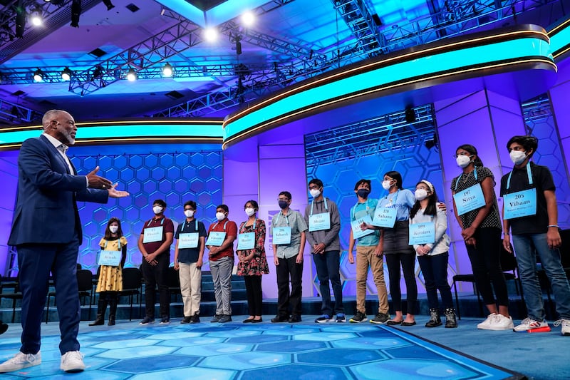Actor LeVar Burton gestures to the 12 finalists during the Scripps National Spelling Bee. AP
