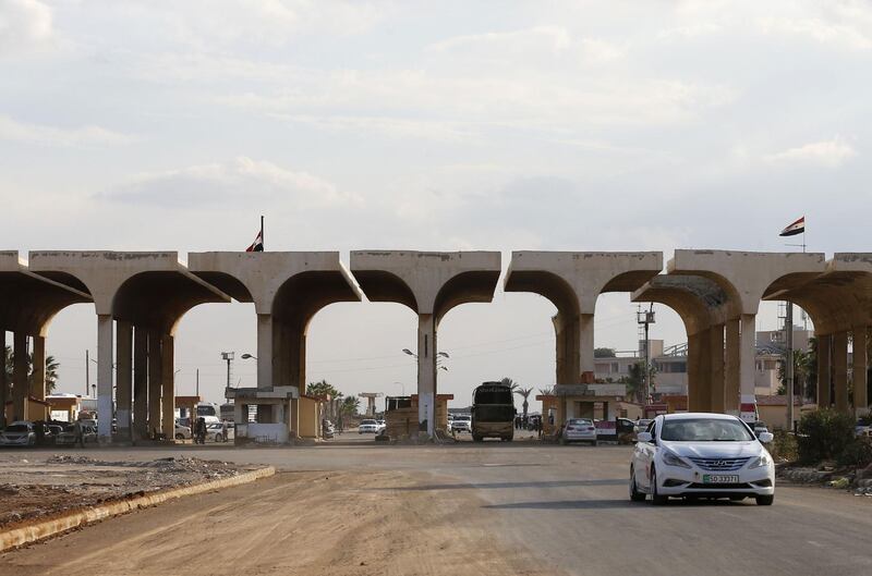 A vehicle steers his way through the recently reopened Nassib border post in the Deraa province,at the Syrian-Jordanian border south of Damascus on November 7, 2018.  Syrian regime forces retook control of the Nassib border crossing from rebels in July, and last month reopened it after a three-year closure, allowing Jordanians to dash over for cheap shopping. / AFP / LOUAI BESHARA
