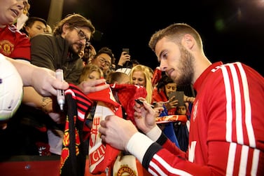 epa07709719 David De Gea of Manchester United signs autographs after a training session at the WACA in Perth, Australia, 11 July 2019. The English Premier League club is in Australia as part of a pre-season tour and will play friendly matches against Perth Glory on July 13 and Leeds United on July 17. EPA/RICHARD WAINWRIGHT AUSTRALIA AND NEW ZEALAND OUT