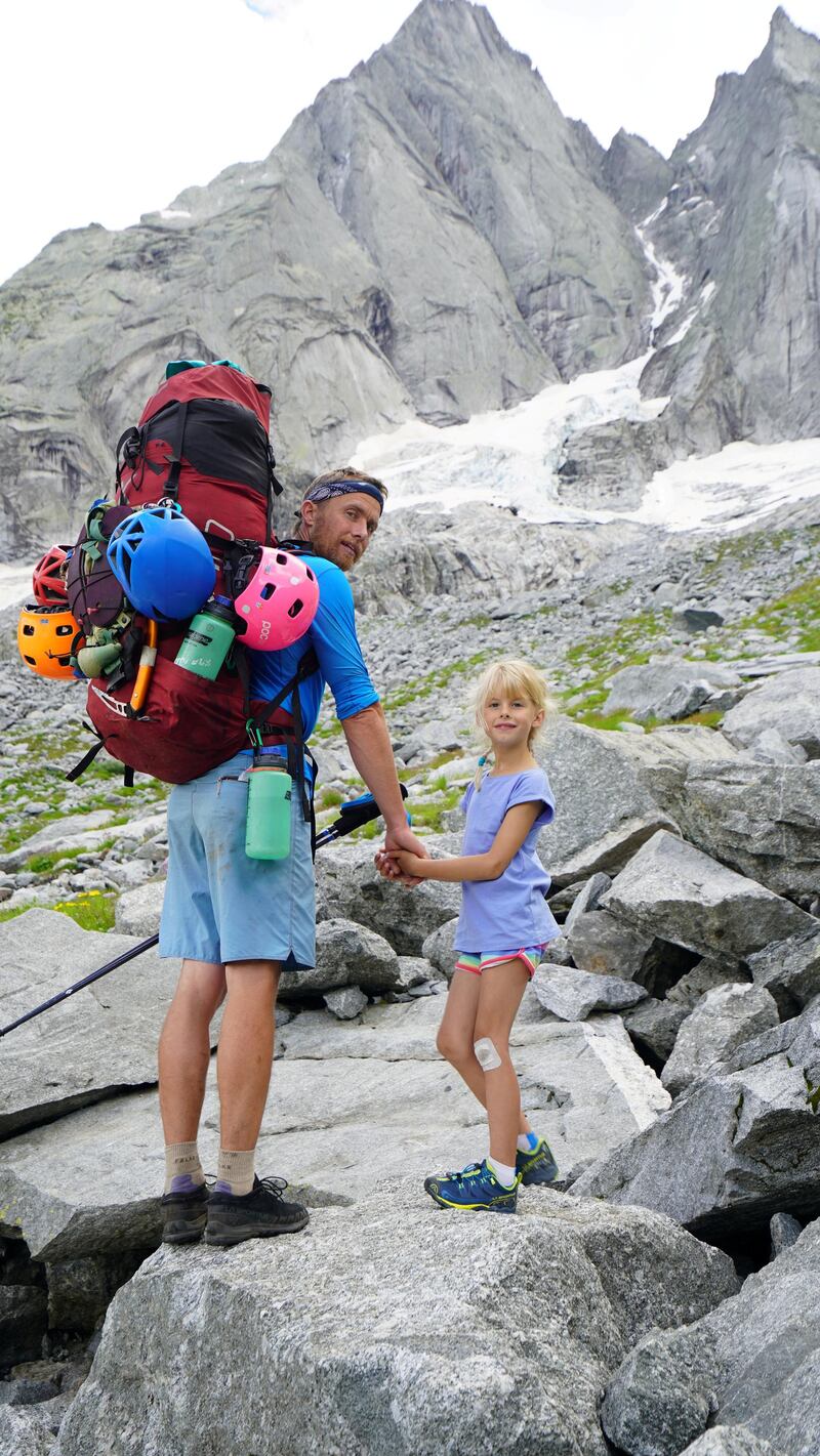**Sent under embargo, no use before 14.00pm BST August 3 2020**
Leo Houlding with his Freya on their three day trip to climb Piz Badile. See SWNS story SWPLclimb; A toddler and his seven-year-old sister have smashed records to become the youngest mountain climbers to scale a massive 10,000ft peak and were given a reward - of Haribo. Freya Houlding, seven, and three-year-old Jackson were literally following in their professional climber father's footsteps as he led them up Piz Badile on the border of Switzerland and Italy. Dad Leo Houlding, 40, spends his working life climbing some of the most dangerous and most remote mountains on earth, and his wife, 41-year-old Jessica, a GP, is an avid climber too. And now Freya has become the youngest person to climb the mountain unaided, and Jackson the youngest person to get to the top - 153 years to the day since the peak was first climbed. Jackon says he enjoyed his climb - and the sweets he got as a well done.