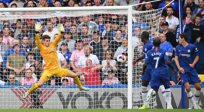 Chelsea's Spanish goalkeeper Kepa Arrizabalaga jumps to make a save. AFP
