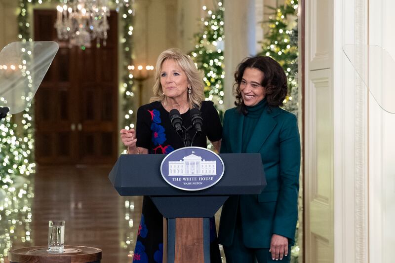 US first lady Jill Biden stands with Daria Peoples, an elementary school art teacher and children's book author from Las Vegas, Nevada, who contributed to the decorations. EPA