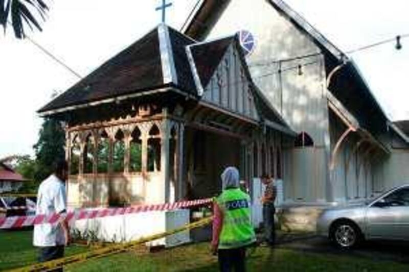 Police officers inspect damage at the All Saints Church in Taiping of Perak state, Malaysia, Sunday, Jan. 10, 2010. Another church was hit by a firebomb early Sunday, the fifth assault in three days of unrest following a court decision that allows Christians and other non-Muslims to use "Allah" to refer to God. (AP Photo) ** MALAYSIA OUT, NO SALES, NO ARCHIVE ** *** Local Caption ***  KL801_Malaysia_Allah_Ban.jpg