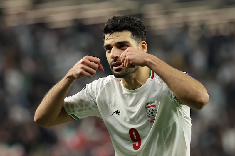 Mehdi Taremi of Iran celebrates scoring his team's second goal. Getty Images