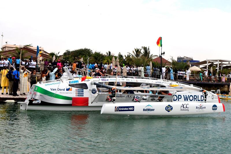 Local residents wait for the Row4ocean trimaran to leave Dakar to cross the Atlantic on December 14, 2018. AFP