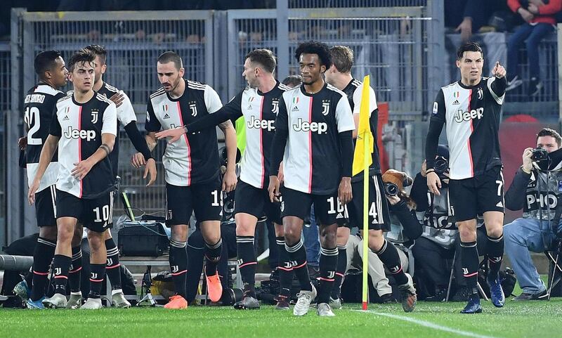 Juventus' Cristiano Ronaldo (R) celebrates with his teammates. EPA