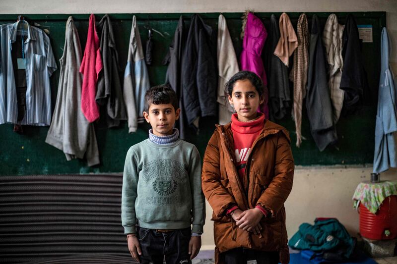 Twins Maha, right, and Mohammad Al Obaid, 11, were born in 2011, the year the Syrian war started. Displaced from Ras Al Ain in north-east Syria three years ago, they are pictured at a school on the outskirts of north-eastern city Hassakeh. All photos: AFP