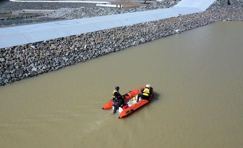 Search and rescue teams look for the body of a man who went missing during a flash flood in the UAE. Courtesy RAK Police