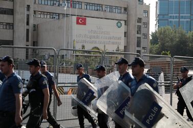 Turkish police walk in front of the Metropolitan Municipality headquarters in Diyarbakir, Turkey, on Monday. Reuters
