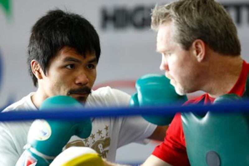 Baguio, Philippines, March 20, 2011- (left) Manny Pacquiao (right) Freddie Roach at Pacquiao training facility. Pacquiao is training in Baguio, Phillippines and will fight Shane  Mosely  May 7th in Las Vegas Nevada. Pacquiao and his training team are in Baguio Philippines approximately 250km North of Manila.  Mike Young / The National
