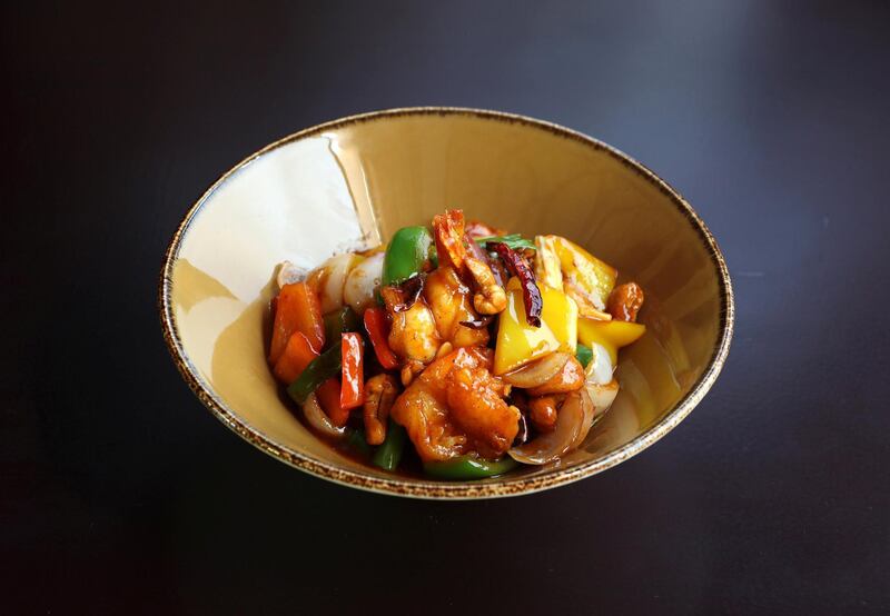 Dubai, United Arab Emirates - May 09, 2019: Iftar Signature Dish. Goong Phad Med Ma Muang,ÊWok-fried crispy prawns with cashew nuts, spring onions, dried chili and oyster sauce from Pai Thai at Jumeirah Al Qasr. Thursday the 9th of May 2019. Dubai. Chris Whiteoak / The National

Chefs description:ÊThis is a favourite with all our guests which is why it made the shortlist to our Iftar menu. The combination of seafood, nuts and traditional Thai ingredients makes this dish a welcome alternative main course for those looking to enjoy an Iftar meal twist.