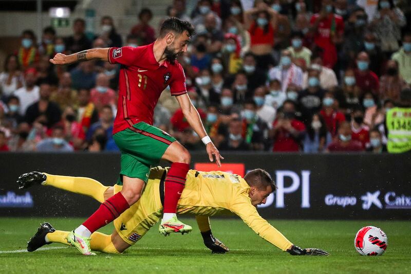 Portugal midfielder Bruno Fernandes vies with Luxembourg goalkeeper Anthony Moris. AFP