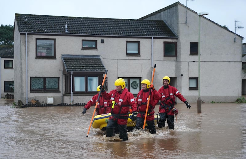 Members of a coastguard rescue team in Brechin. Storm Babet dumped 25cm of rain in some areas. PA