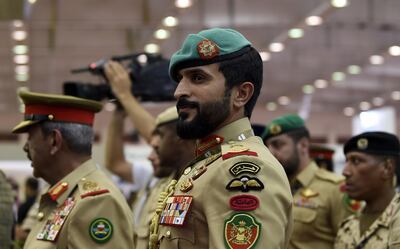 CORRECTION / Major General Nasser bin Hamad Al Khalifa (R), a member of the Bahraini royal family and  commander of Bahrain's Royal Guard, attends the opening of the Bahrain International Defence Exhibition and Conference (BIDEC) in the Bahraini capital Manama on October 28, 2019.  BIDEC, which will run until October 30 has exhibitors from over 30 countries. / AFP / Mazen Mahdi
