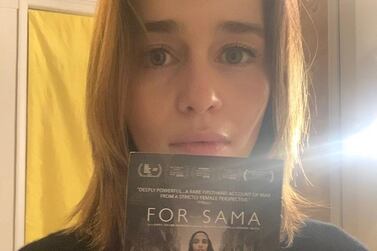 Emilia Clarke holds the poster of Syrian documentary 'For Sama'. Instagram